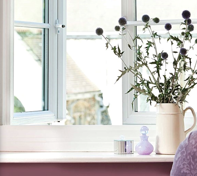 Flowers in a vase on a window sill