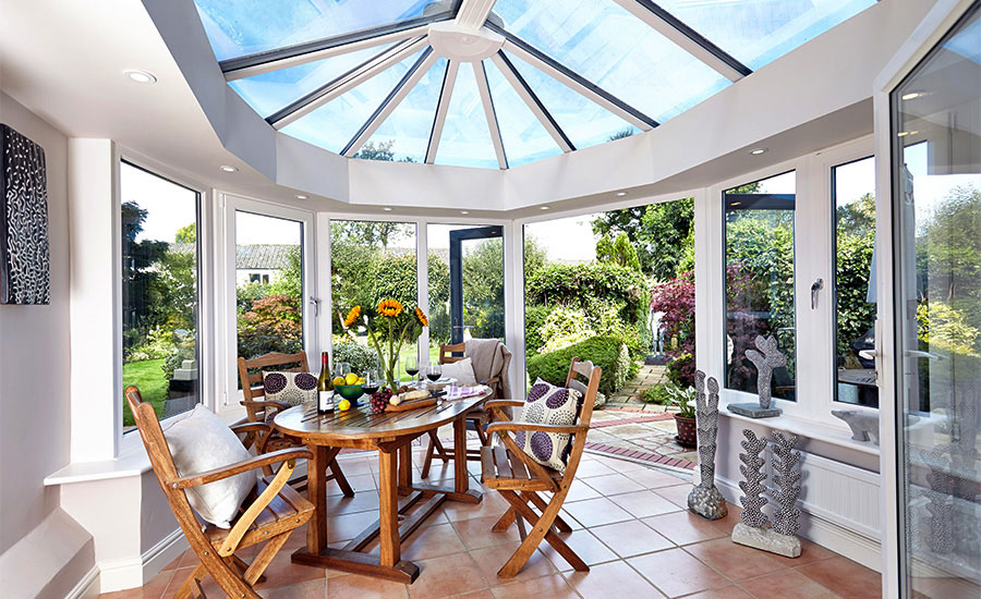 uPVC conservatory by Anglian Home Improvements interior of conservatory with dining table and chairs
