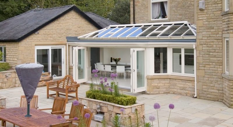 cream orangery with open bifold doors