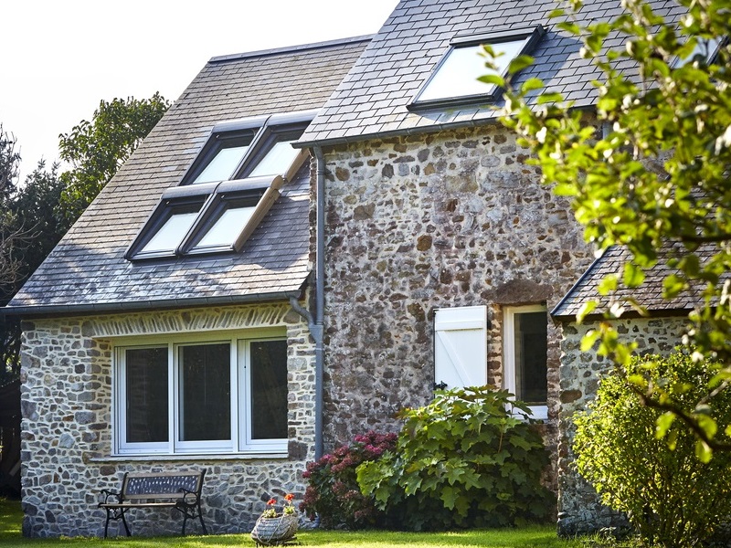 Roof windows by GGF Member company VELUX stone house with velux roof windows