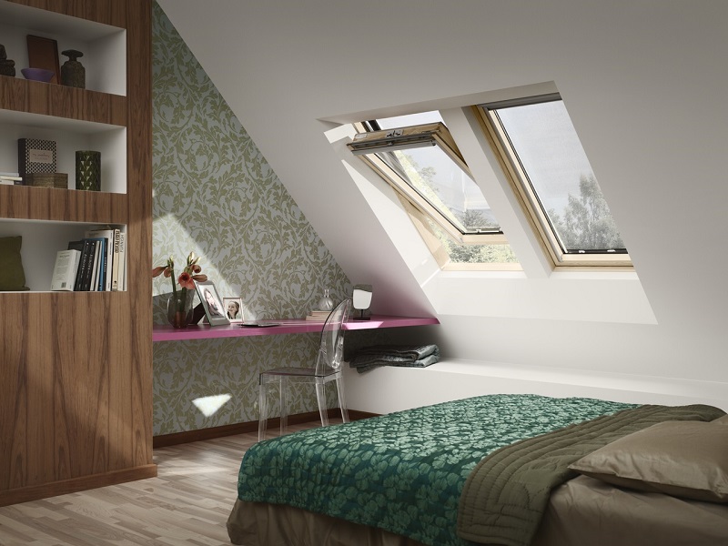 Roof windows by GGF Member company VELUX bedroom with bed, desk and roof windows